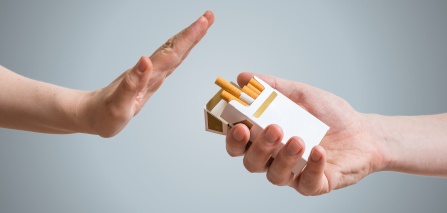 A hand refusing the offer of a cigarette