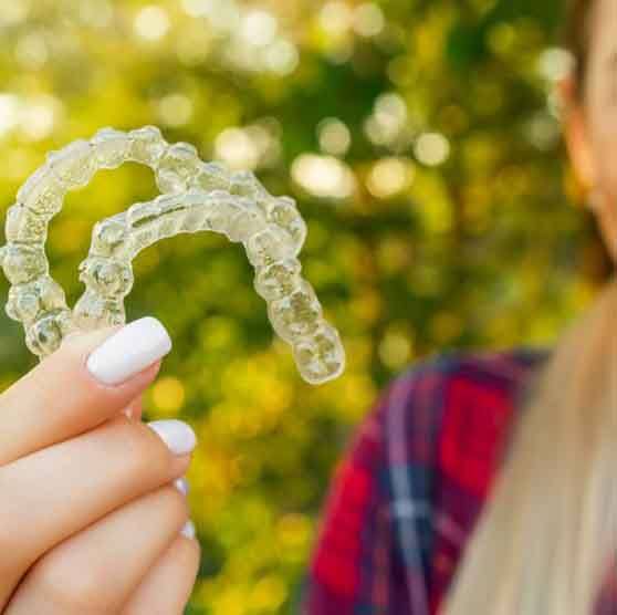 Teen shows her clear aligners